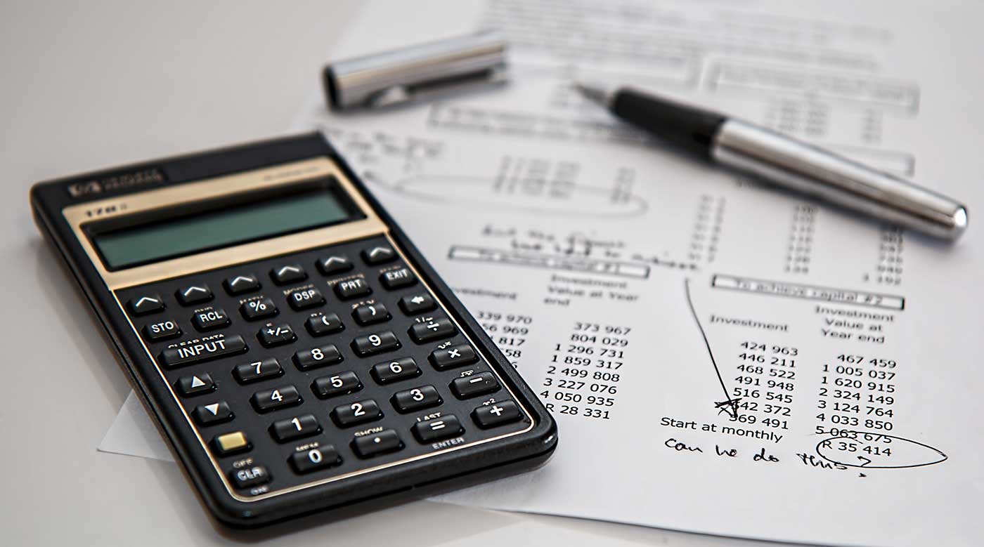 Photograph of a calculator and a financial document