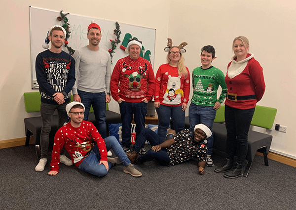 The Ireland Website Design posing for a group photo at Christmas. Left to right; Joseph, Jonathan, Krystian, Nick, Abby, Tohiru, Riley, Annemarie