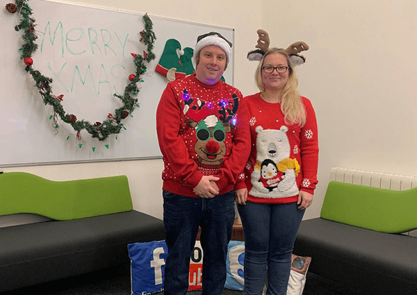 Nick & Abby wearing Christmas jumpers